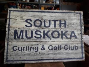 South Muskoka Curling Club sign on barn board 